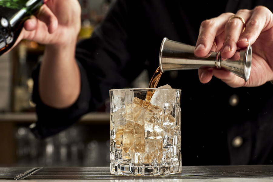 Bartender preparing drink at Bistrot Bisou